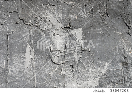 The texture of gypsum or alibaster cracked plaster on the wall is a thick layer. Gradient gray putty The texture of gypsum or alibaster cracked plaster on the wall is a thick layer. Gradient gray putty 58647208