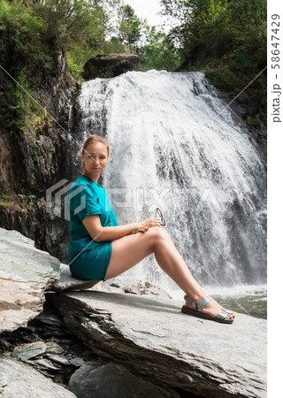 Woman at Korbu Waterfall Woman at Korbu Waterfall 58647429