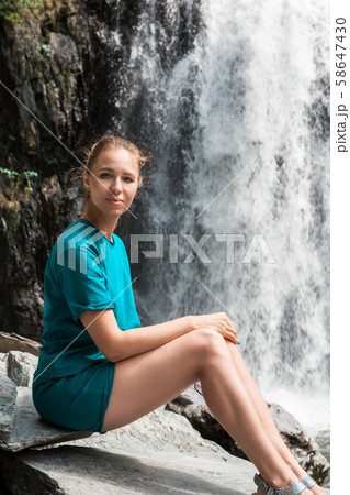 Woman at Korbu Waterfall Woman at Korbu Waterfall 58647430