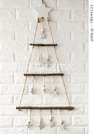 Wooden stylish Christmas tree in scandinavian style  58649133