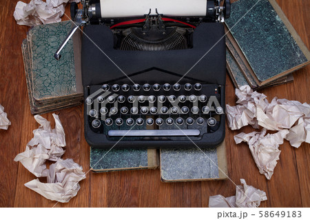 Old retro vintage typewriter with paper on wooden Old retro vintage typewriter with paper on wooden 58649183