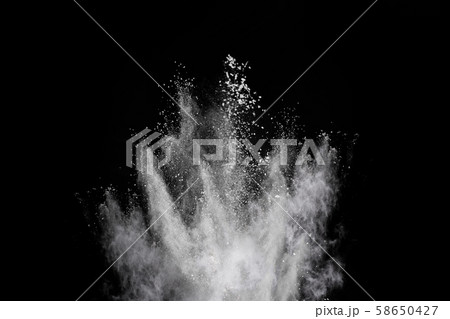 White powder explosion on black background.  58650427