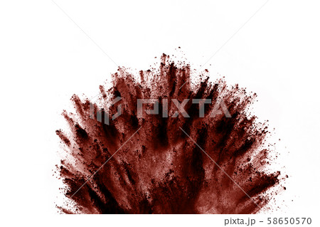 Brown color powder explosion on white background. Brown color powder explosion on white background. 58650570
