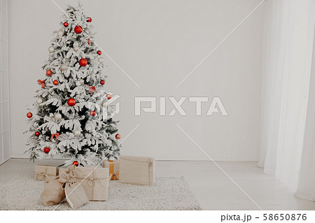 Christmas tree with gifts of the new year home background Christmas tree with gifts of the new year home background 58650876
