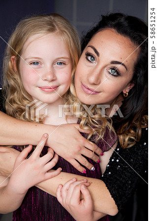 Portrait of a beautiful mom and daughter of 10 years 58651254