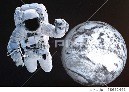 Astronaut near the frozen Earth planet 58652441