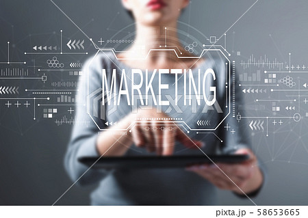 Marketing concept with woman using a tablet Marketing concept with woman using a tablet 58653665
