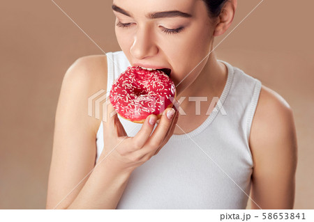 Diet Concept. Young Woman Measuring Body Weight On 58653841