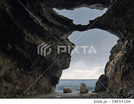 A View from a big cave with two openings A View from a big cave with two openings 58654106