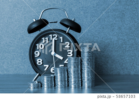 Alarm clock and step of coins stacks on working 58657103