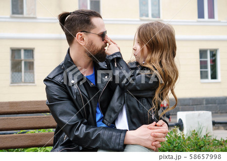 Dad and daughter walk around the city Dad and daughter walk around the city 58657998