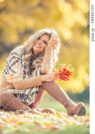 Attractive young woman with sensual smile sitting 58660705