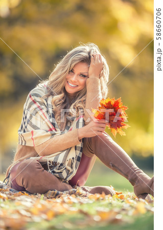 Attractive young woman with sensual smile sitting 58660706