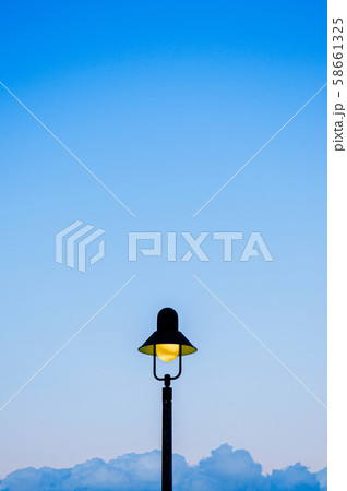 Vintage retro light pole with blue sky background Vintage retro light pole with blue sky background 58661325