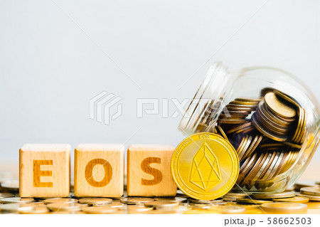 EOS Coins and Wood block word EOS. 58662503