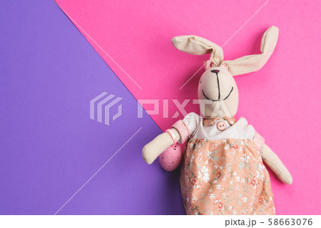 Easter bunny on pink and purple background 58663076