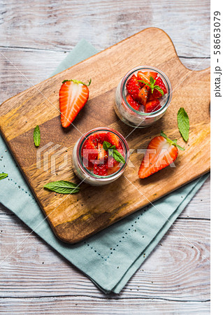 Yogurt and granola with strawberries. Breakfast 58663079