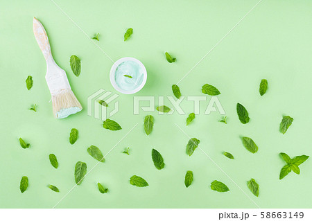 Paint brush on green mint background with pattern Paint brush on green mint background with pattern 58663149