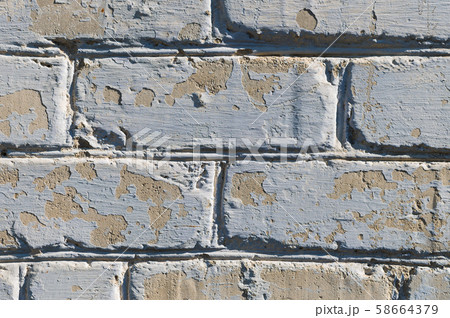 Close-up of an old painted peeling cracked brick 58664379