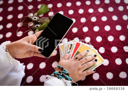 Fortune teller reading fortune lines on screen 58668336