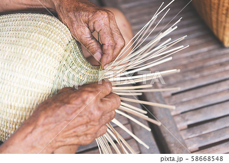 weaving bamboo basket wooden - old senior man hand 58668548