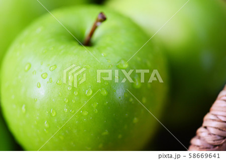 Fresh green Apples - harvest apple in the basket 58669641