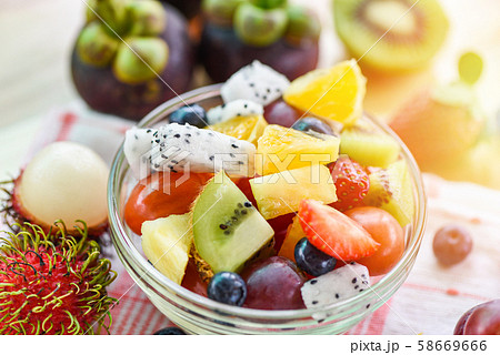 Fruit salad bowl fresh summer fruits and Fruit salad bowl fresh summer fruits and 58669666