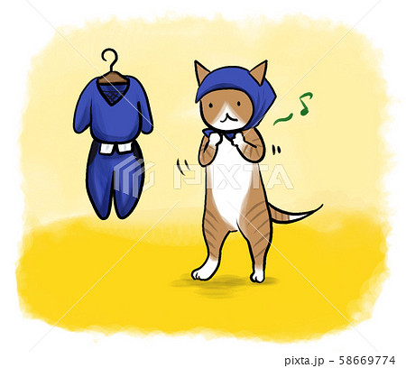 お出かけの服装にお着替えをする、茶トラのネコさん 58669774