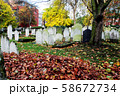 Autumn ancient graveyard with orange leaves and 58672734