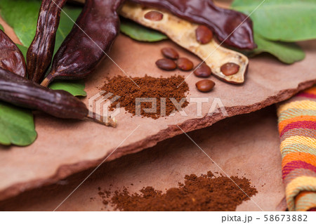 Carob. Organic carob pods with seeds and leaves Carob. Organic carob pods with seeds and leaves 58673882