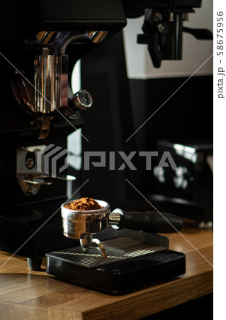 freshly ground coffee in a portafilter 58675956