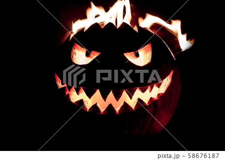 Spooky halloween pumpkin has hot fire flame head 58676187