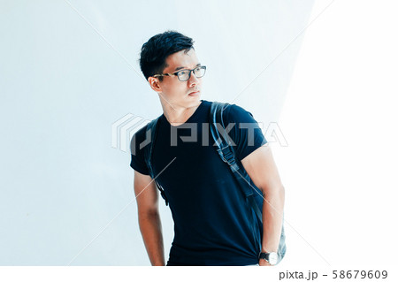 Young handsome asian men wearing casual black Tshirt on white background in Sai Gon city, Vietnam 58679609