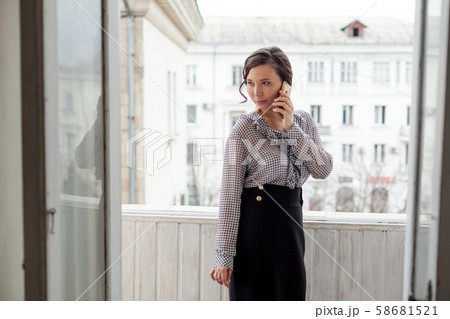 beautiful Asian woman talking on a smartphone 58681521