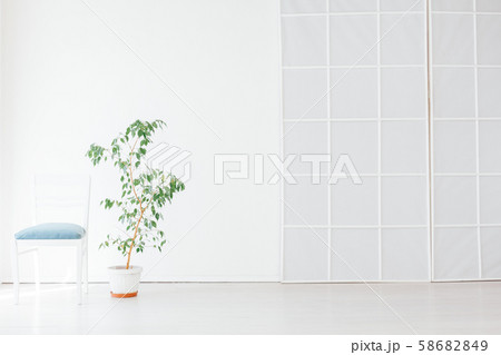 white vintage chair in the interior of an empty white room white vintage chair in the interior of an empty white room 58682849