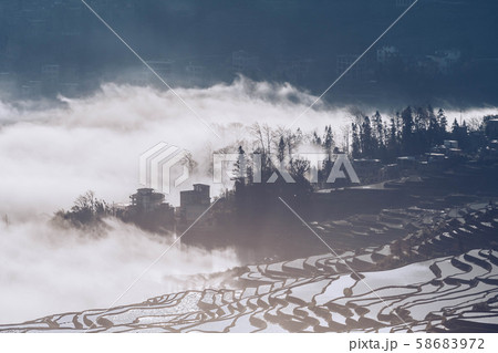 Small village and Terraced rice fields of YuanYang China with sea of fog and cloud 58683972
