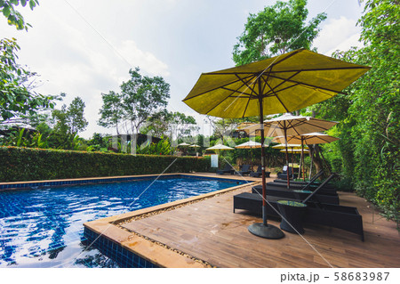 Relaxing area beside swimming pool Relaxing area beside swimming pool 58683987