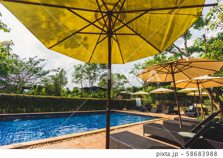 Relaxing area beside swimming pool Relaxing area beside swimming pool 58683988