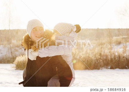 Teens brother and sister having fun snow in winter 58684916