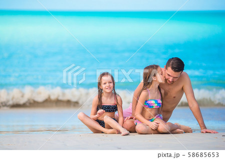 Father and kids enjoying beach summer vacation Father and kids enjoying beach summer vacation 58685653