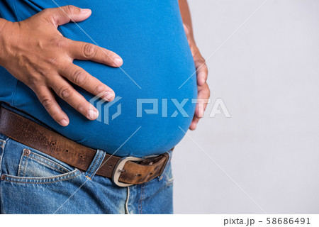 Overweight or fat adult man in very tight jeans Overweight or fat adult man in very tight jeans 58686491