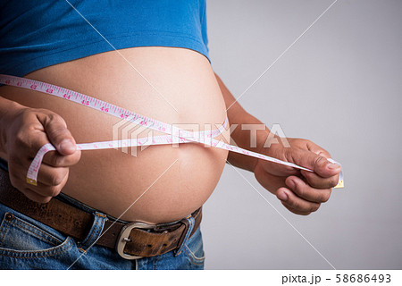 Overweight or fat adult man in very tight jeans 58686493