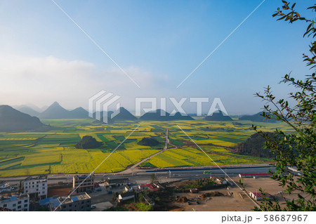 Small villages with Rapeseed flowers at Jinjifeng(Golden Chicken Peak), China 58687967