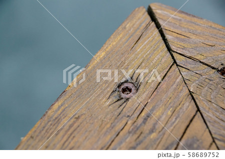 Screws screwdriver twist in wooden board. close up Screws screwdriver twist in wooden board. close up 58689752