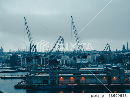 Photo of river, floating cranes, buildings on river bank 58690658