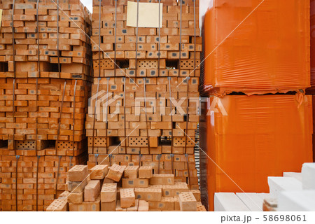 Hardware store assortment, packs of red bricks 58698061