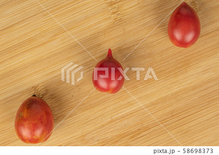 Fresh tomato de barao on light wood Fresh tomato de barao on light wood 58698373