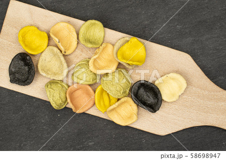 Pasta orecchiette on grey stone 58698947