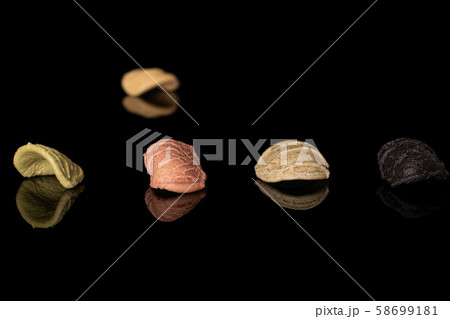 Pasta orecchiette isolated on black glass 58699181