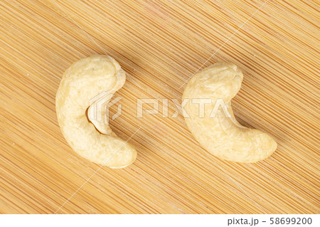 Fresh cashew nut on light wood Fresh cashew nut on light wood 58699200